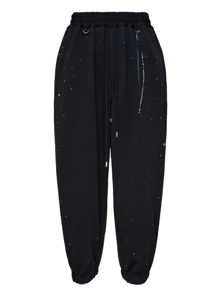 Mastermind black jersey joggers embellished with scattered Swarovski crystals, with drawstring waist, D-ring and ribbon tassel detail