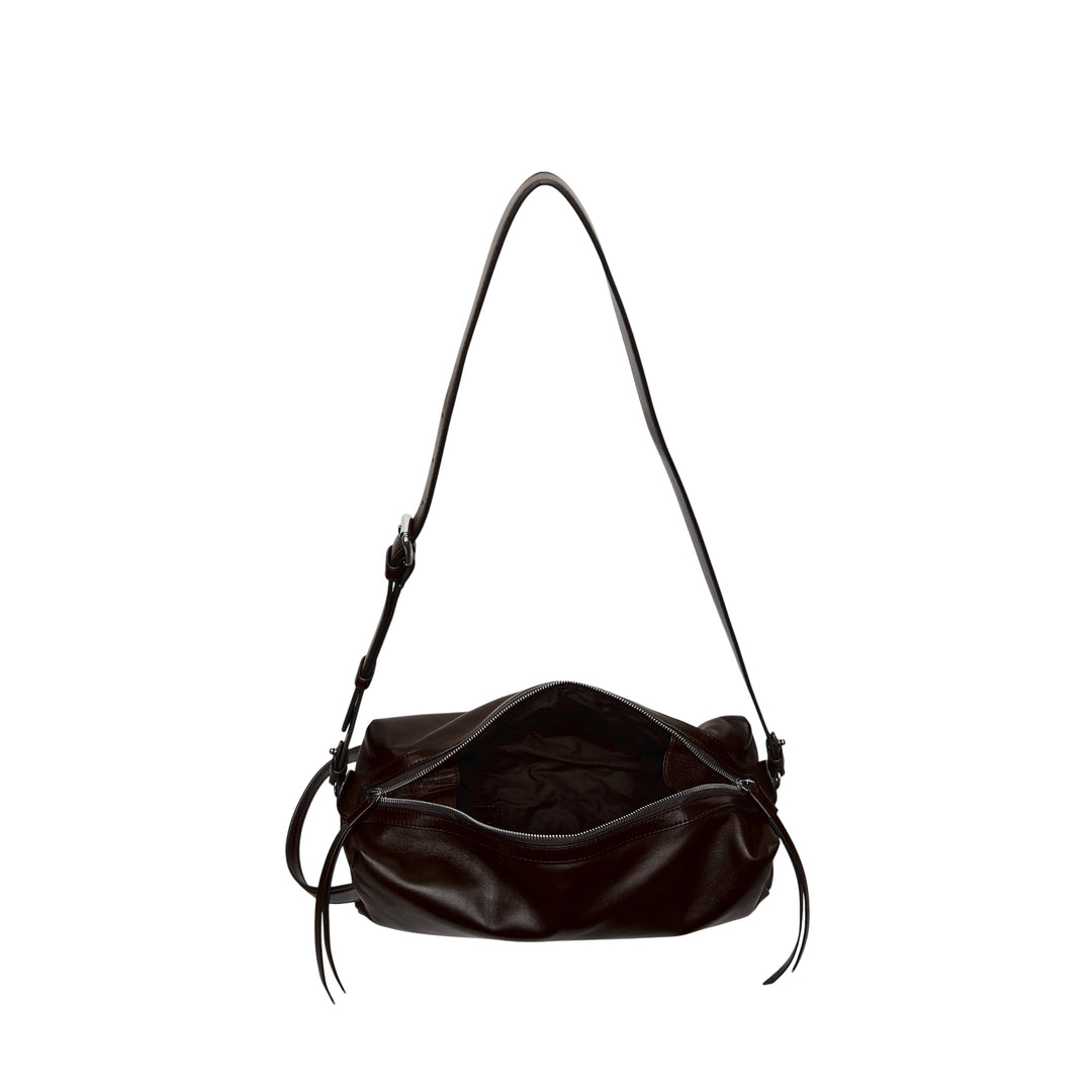 Lemaire Care Sling Bag in dark brown nappa lambskin with adjustable crossbody strap and zip closure, front view on white background