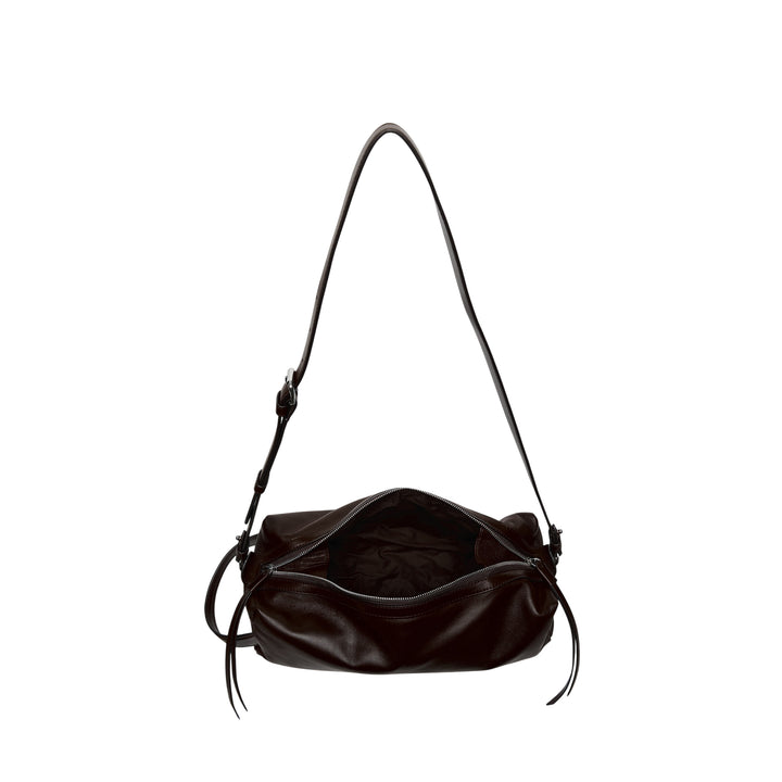 Lemaire Care Sling Bag in dark brown nappa lambskin with adjustable crossbody strap and zip closure, front view on white background