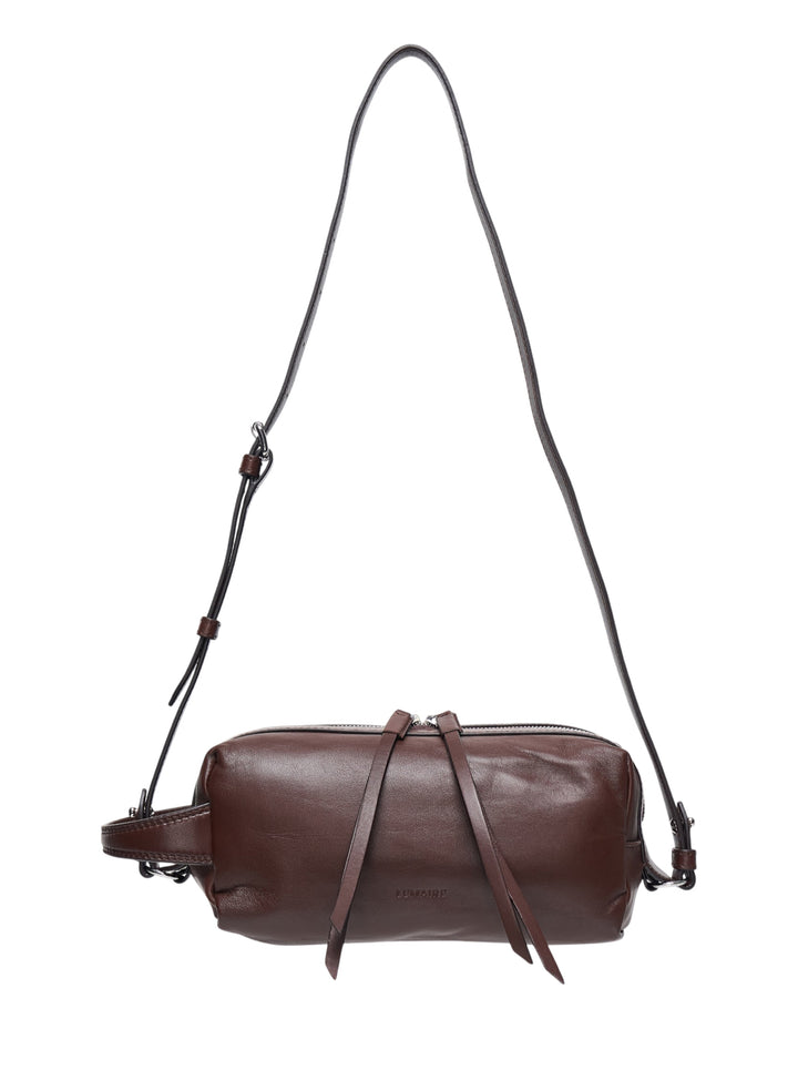 Lemaire Small Care Bag in dark brown nappa lambskin with adjustable crossbody strap, top zip closure, and knotted leather pull ties