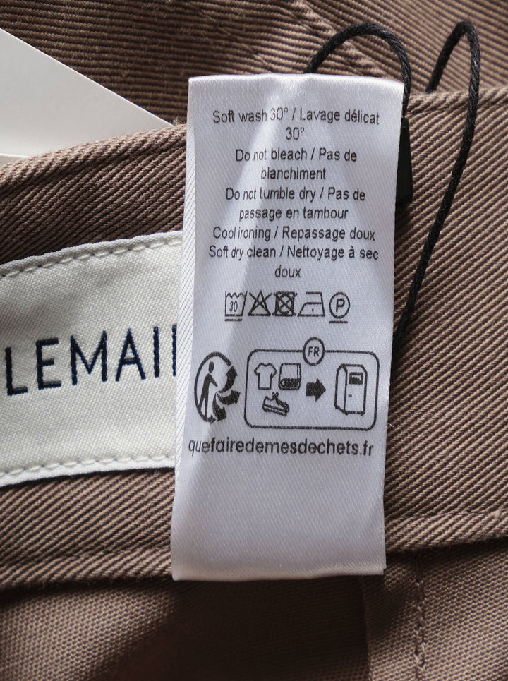Lemaire Barrel Poly Cotton Pants in warm taupe, featuring a wide-leg silhouette, front pintuck seams, and a high-rise snap-button waistband - view 4