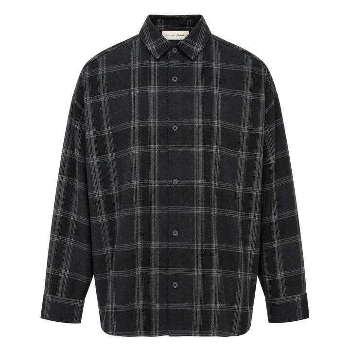 Fear of God Essentials long sleeve plaid button-up shirt in dark navy and grey windowpane check, relaxed oversized fit with concealed placket and tonal buttons, flat lay on white background