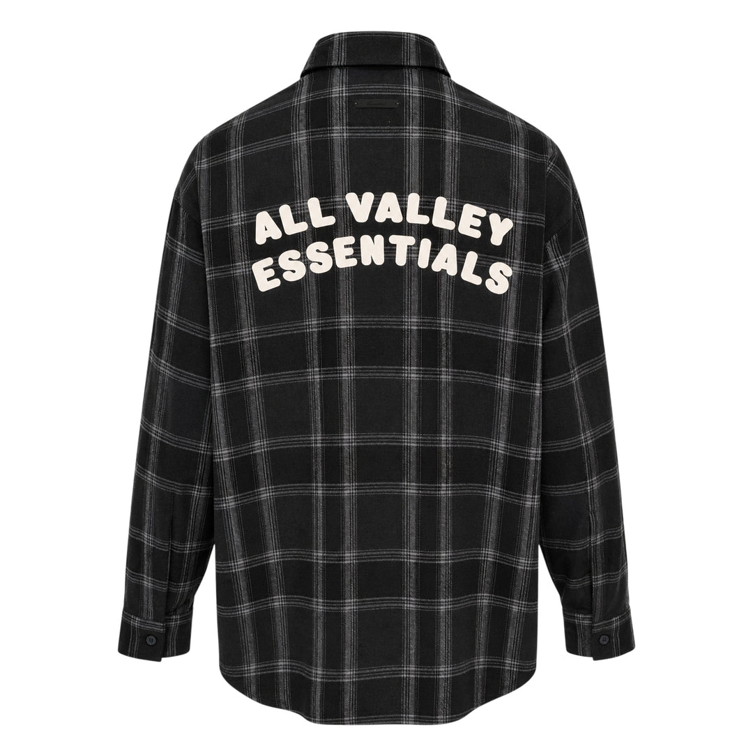 Fear of God Essentials long sleeve plaid button-up shirt in dark navy and grey windowpane check, relaxed oversized fit with concealed placket and tonal buttons, flat lay on white background