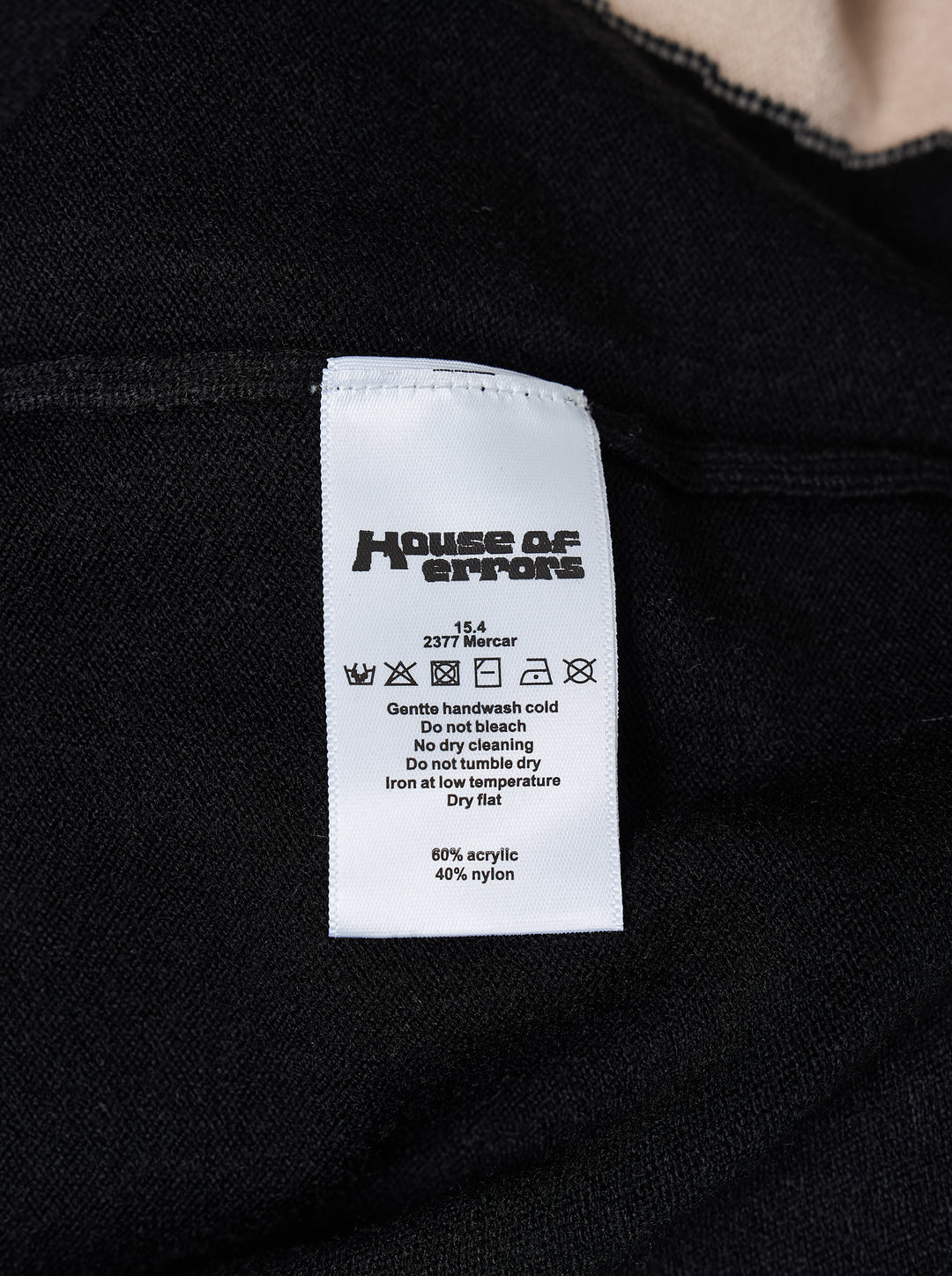 House of Errors Knitted Cat Burglar Rugby Shirt in black with cream panels, polo collar, pearl buttons and chenille script lettering - view 4