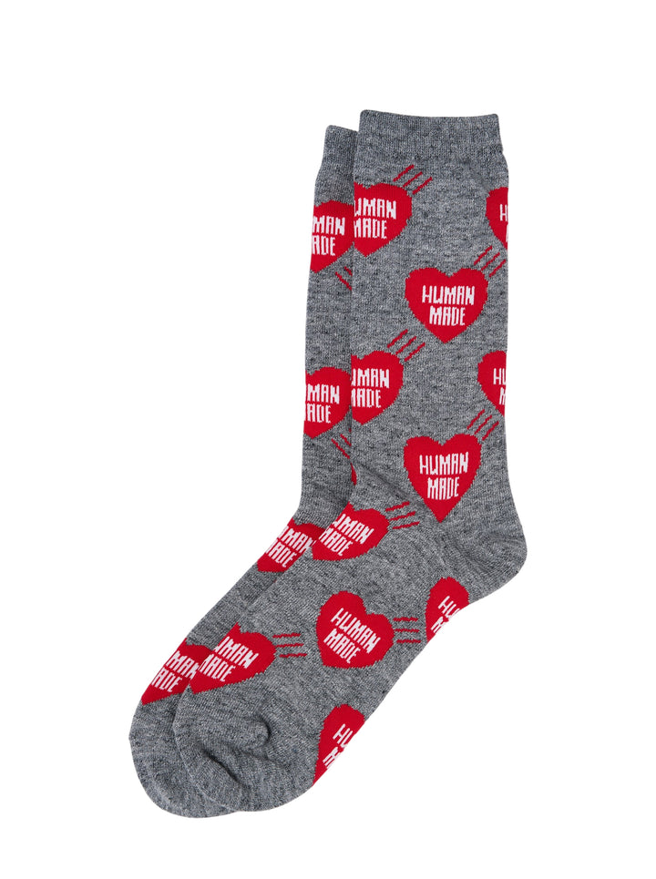 Human Made grey crew socks with all-over red heart logo print featuring 'Human Made' text and radiating line detail