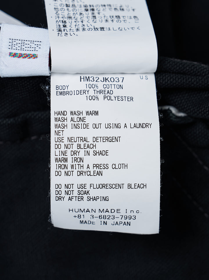 Human Made black zip-up work jacket with corduroy collar, brass two-way zip and embroidered red and white heart logo patch on the chest - view 4