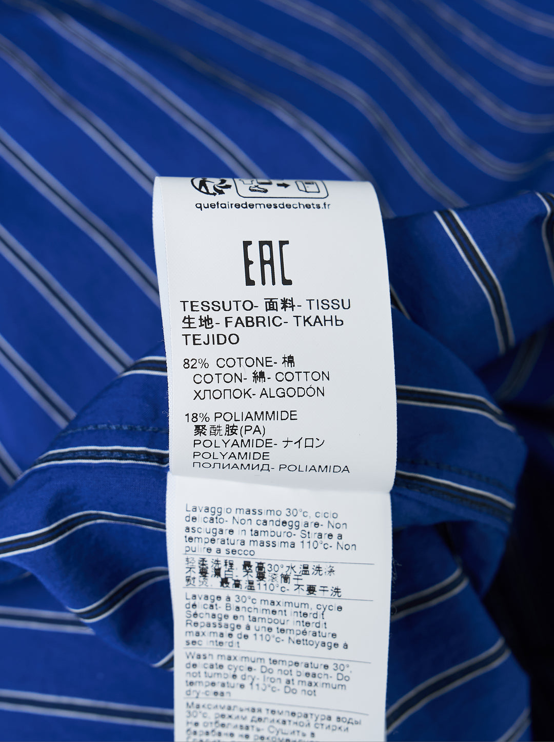 MSGM cobalt blue vertical-stripe oversized long sleeve shirt with an attached diagonal-stripe necktie integrated at the placket, featuring a button-down collar and branded cuff label - view 4