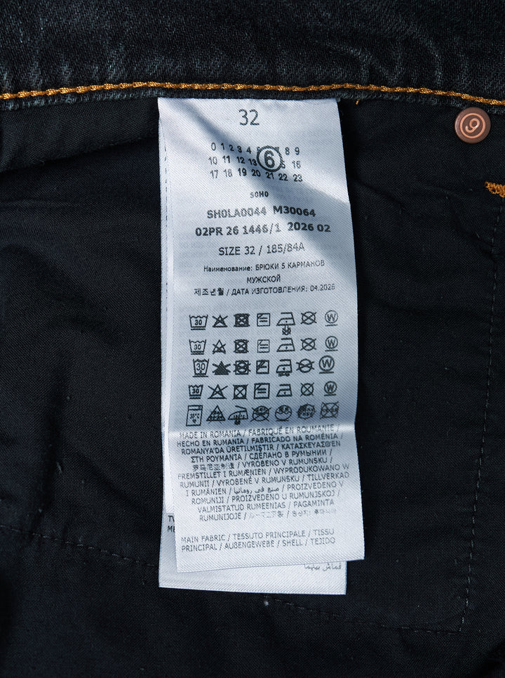 MM6 Maison Margiela black washed denim five-pocket jeans with distressed knee slit and straight leg, front view - view 3