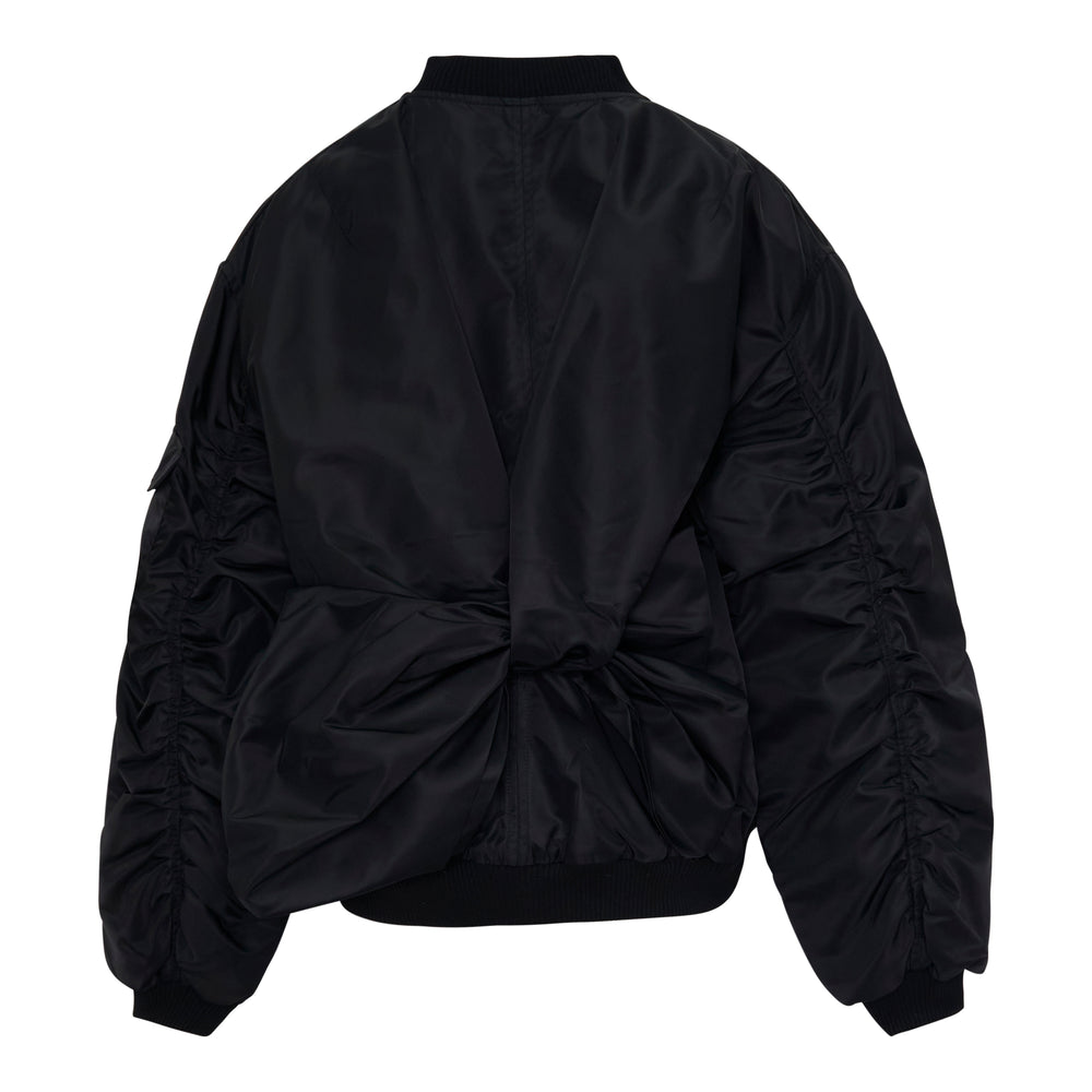 Cecilie Bahnsen Feilan black technical nylon oversized bomber jacket with tonal floral appliqué, full-length zip, dual flap pockets, and ribbed trims