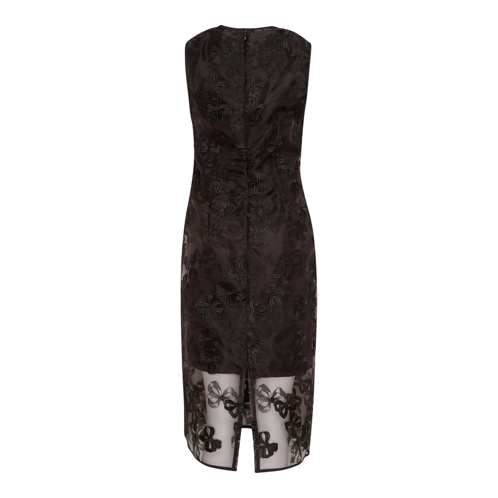 Cecilie Bahnsen Rosette Organza Dress in black, featuring all-over dimensional floral appliqué and a sheer organza hem panel, sleeveless midi silhouette on a white background