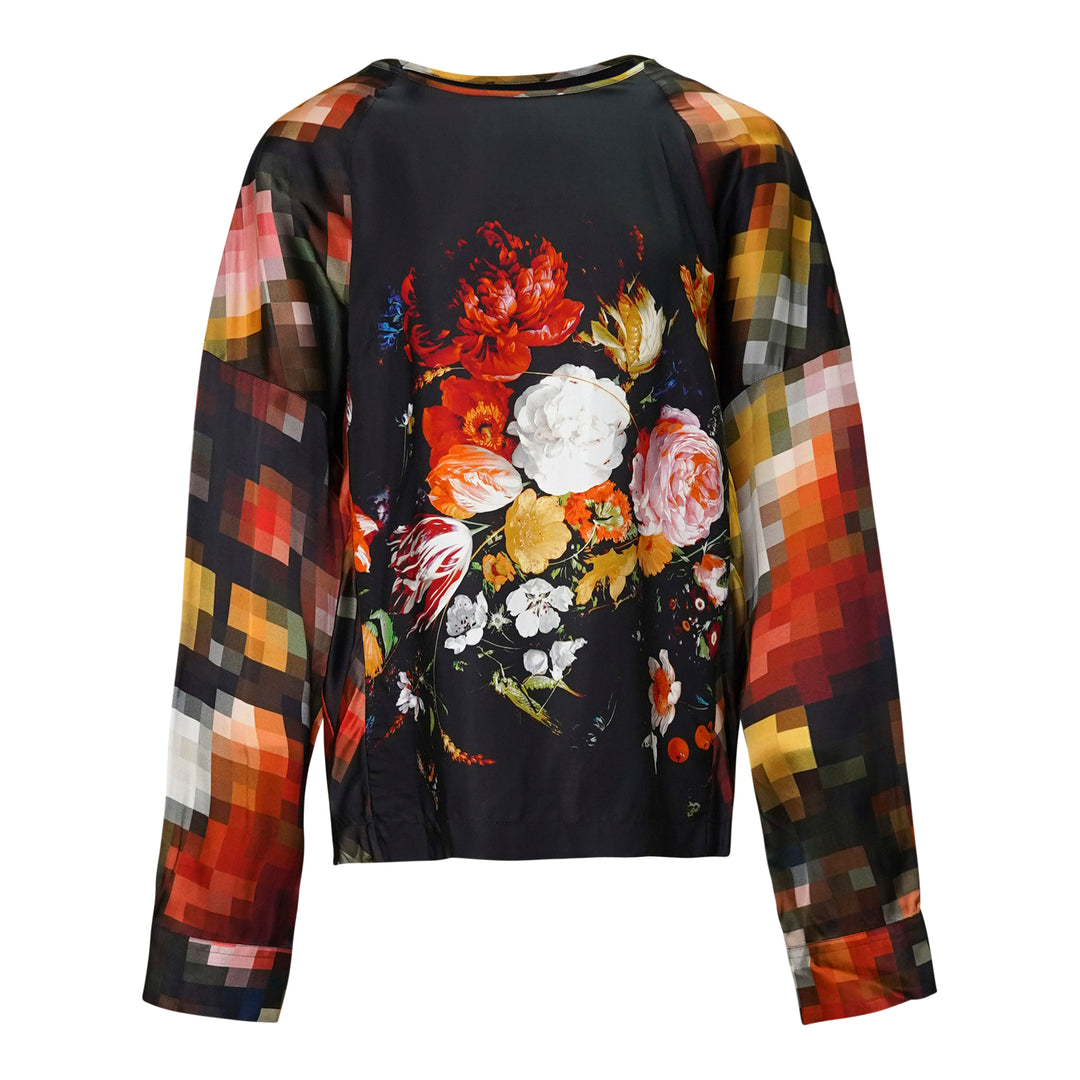 Dries Van Noten long-sleeve woven top — back view — with a Dutch Master floral bouquet print on a black body and pixelated mosaic-print sleeves in warm amber, red, and multicolour tones