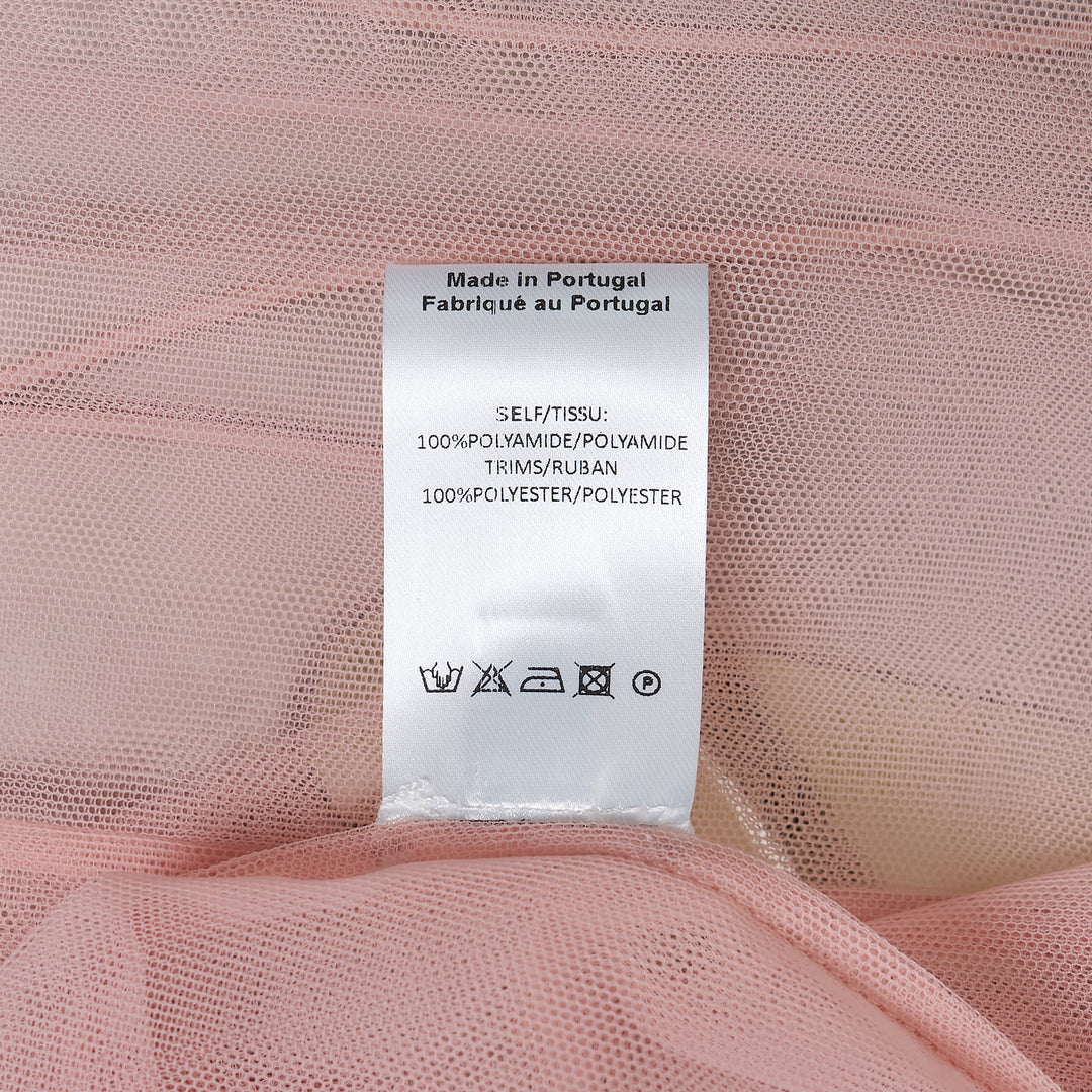 Simone Rocha blush pink sheer organza tulle midi skirt with gathered ruffle waistband and satin drawstring cord ties, front view on white background