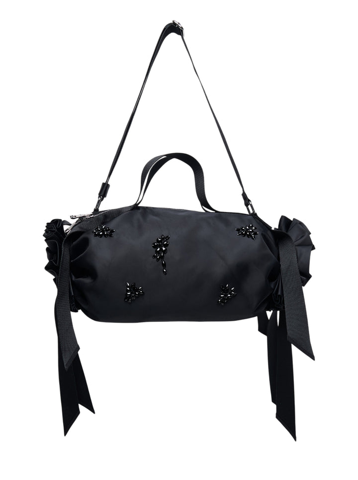 Simone Rocha Double Ribbon Rosette Bag in black satin with beaded floral embellishment, ruffled rosette ends and ribbon tassels