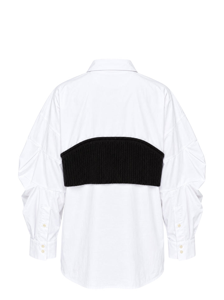 Enfold Knitted Docking Shirt — white cotton poplin long-sleeve shirt with integrated black ribbed knit bandeau panel featuring mother-of-pearl buttons and ruched sleeves, flat lay on white background - view 2
