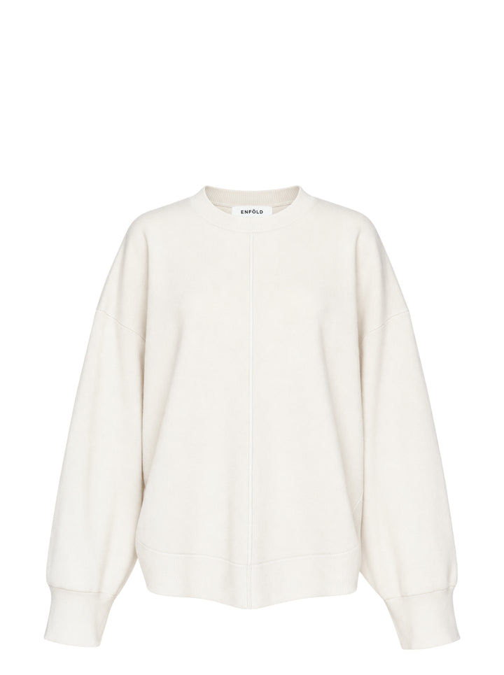 Enfold Circle Hem Pullover Sweatshirt in ivory with oversized silhouette, tonal seam detailing, ribbed cuffs and crewneck with woven brand label