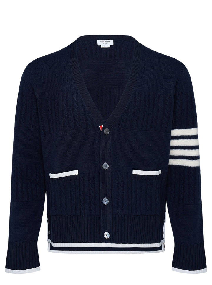 Thom Browne navy V-neck cardigan with cable and Milano stitch panels, white grosgrain trim and signature 4-bar stripe on the sleeve