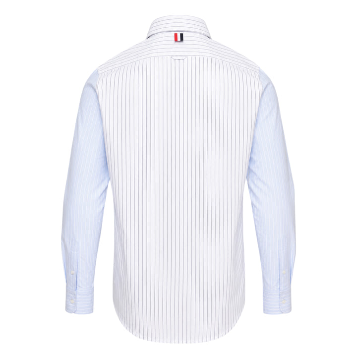 Thom Browne Straight Fit Long Sleeve Shirt in light blue pinstripe with contrast stripe sleeve panels, chest patch pocket, and woven branding label at the hem