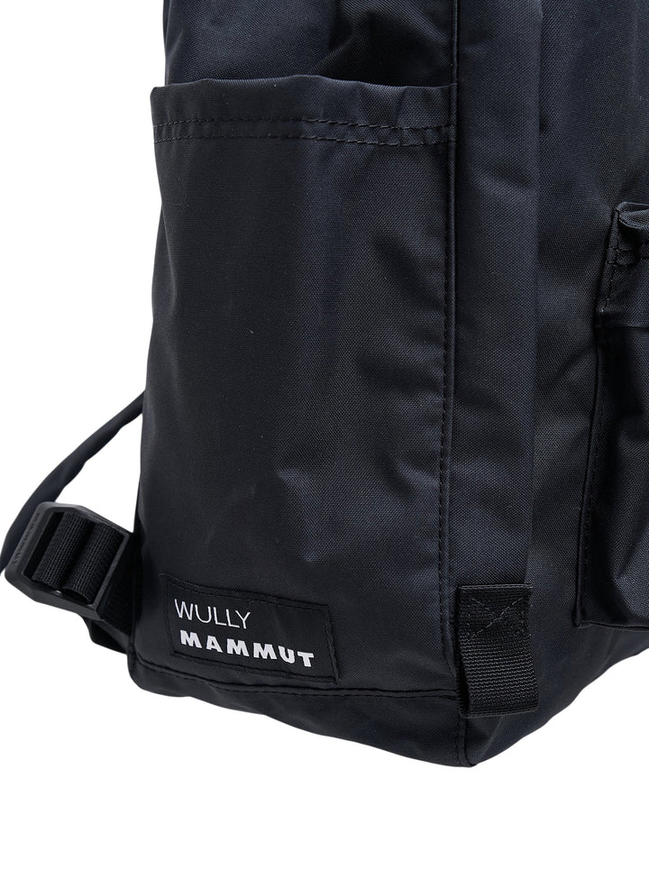 Junya Watanabe x Mammut black backpack with front zip pocket and a plush black mammoth charm clipped to the base - view 5