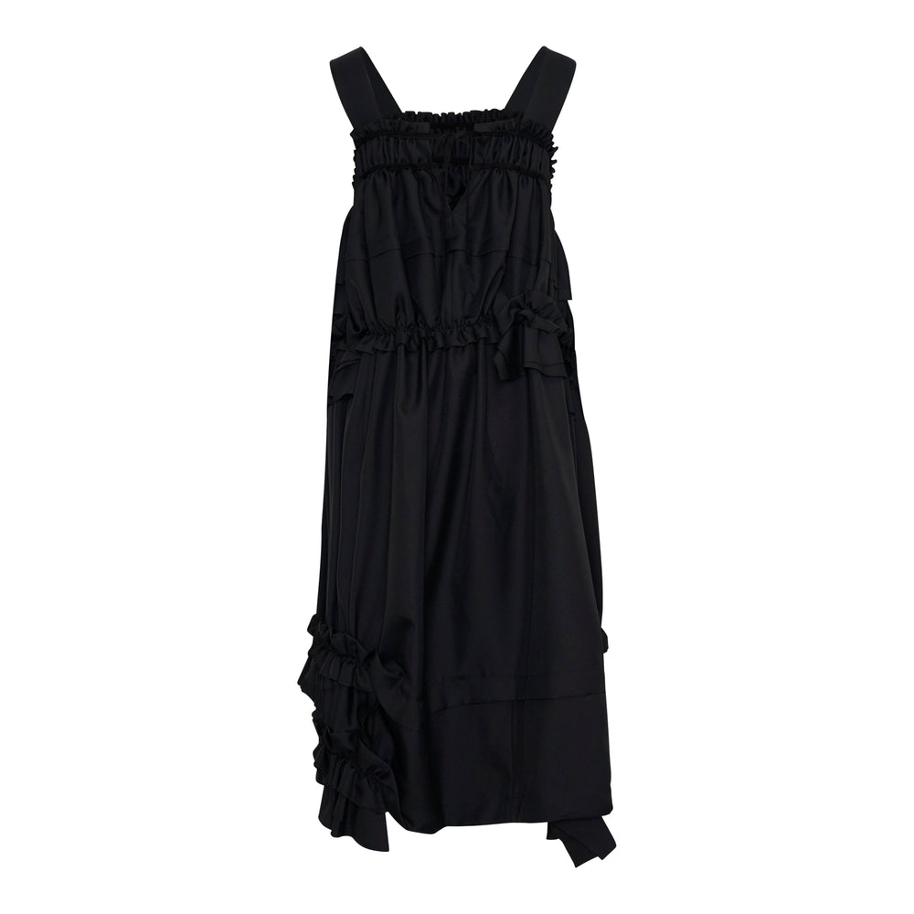 Tao black sleeveless pinafore dress with cascading tiered ruffles, smocked bodice, flat straps, and a voluminous balloon hem, shown on a white background