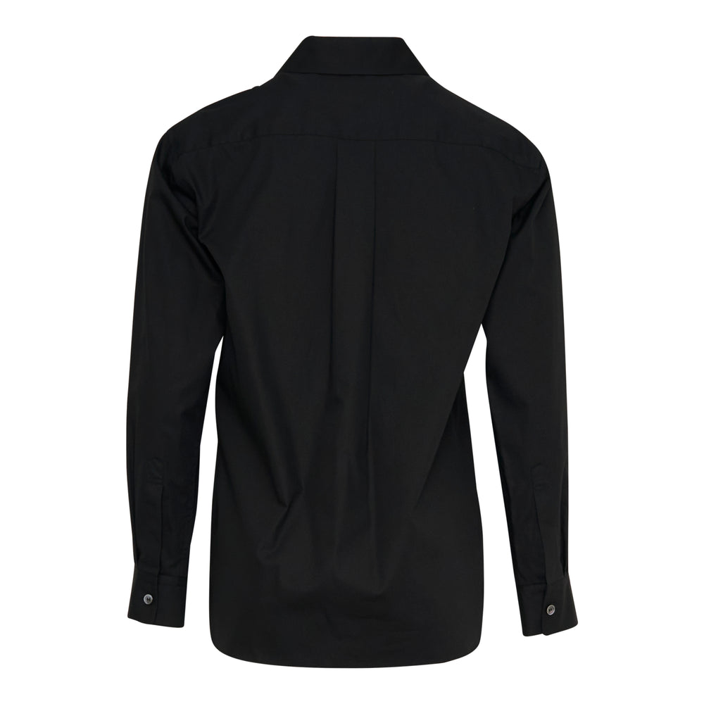 Tao black cotton shirt with vertical ruffle trim cascading down the front placket and elongated frill tails below the hem, featuring a rounded collar and button fastening
