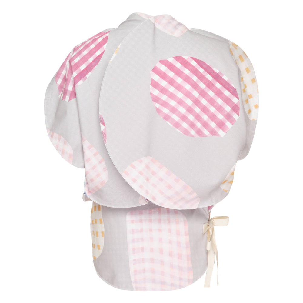 Tao puff silhouette patchwork blouse viewed from the back, featuring voluminous rounded panels in pastel gingham print with a ribbon bow tie at the neckline