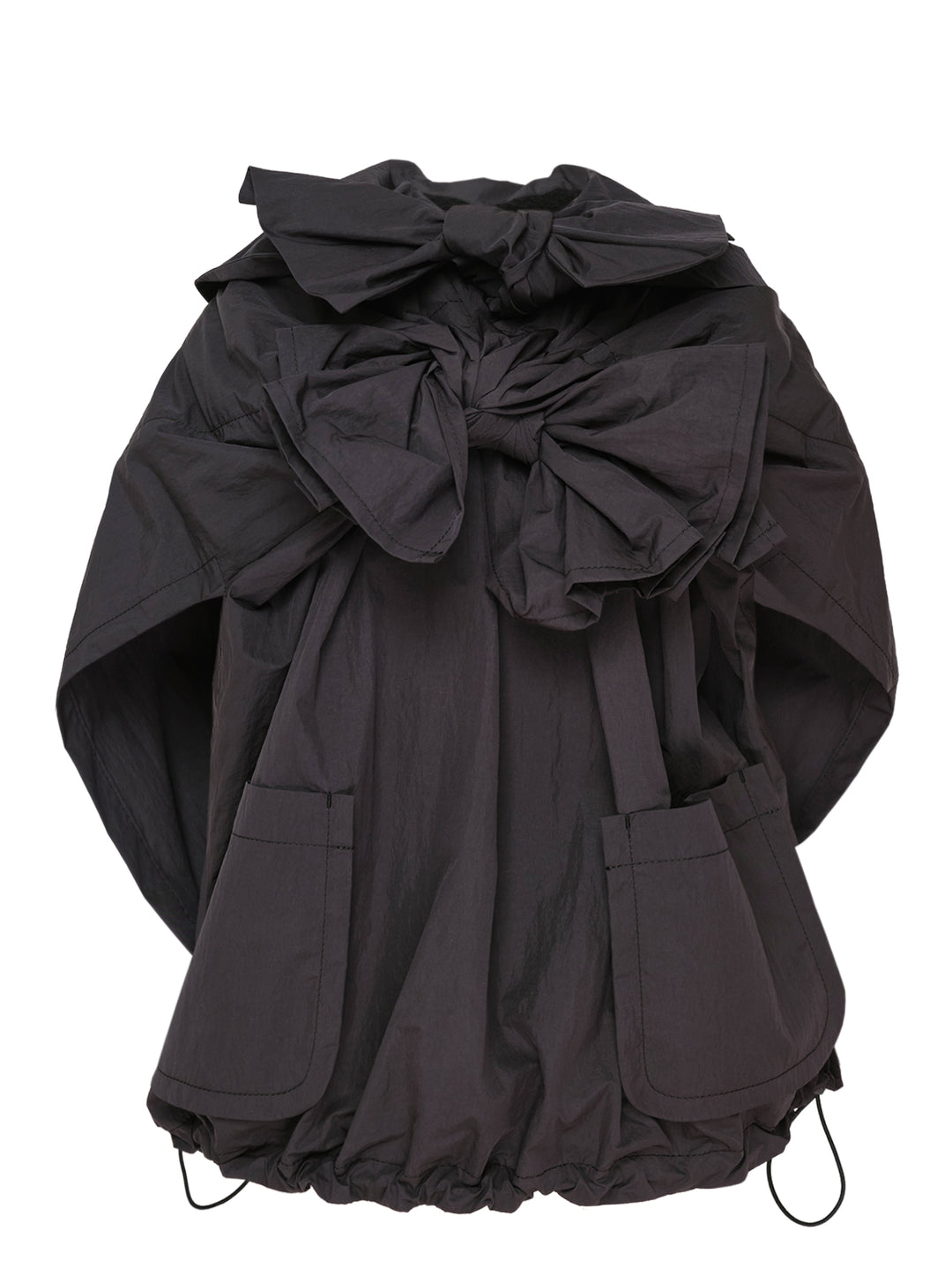 Tao structured cape top in dark charcoal with an oversized gathered bow at the neckline, patch pockets, and a drawstring elasticated hem, displayed on a plain white background