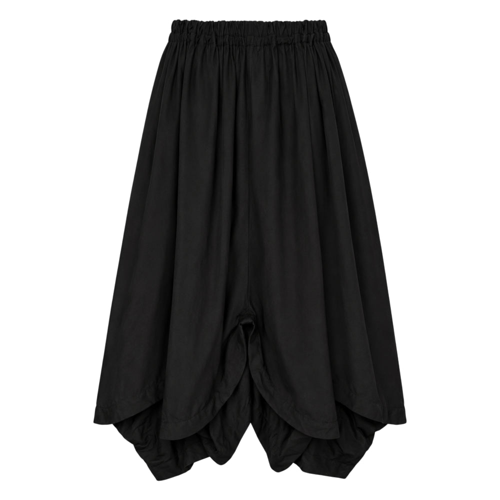 Comme des Garçons Homme crinkled navy polyester wool twill drawstring pants with elasticated waistband and wide-leg silhouette, flat lay on white background