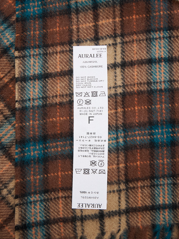 Auralee cashmere long stole in a brown, tan and teal check pattern with twisted fringe ends - view 2