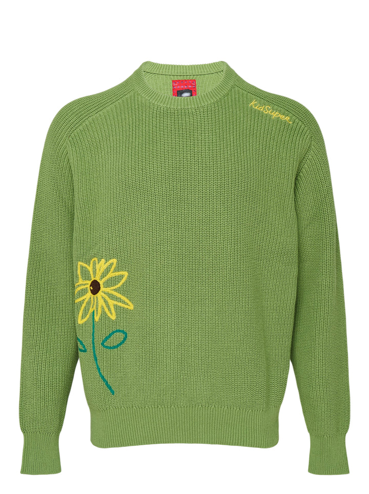 KidSuper Studios green ribbed knit sweater with a yellow embroidered sunflower at the hem and yellow script logo at the shoulder