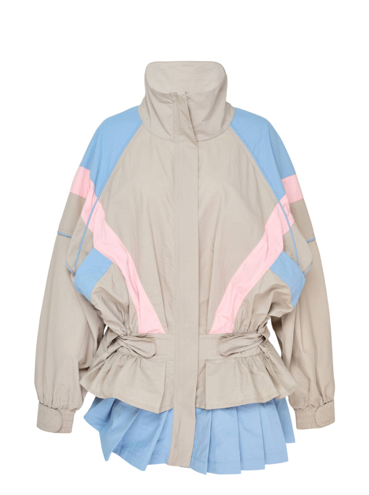 Ashley Williams grey windbreaker dress with sky blue and blush pink colourblock chevron panels, elasticated ruched waist, long sleeves with elasticated cuffs, and a pleated sky blue hem, photographed flat on a white background