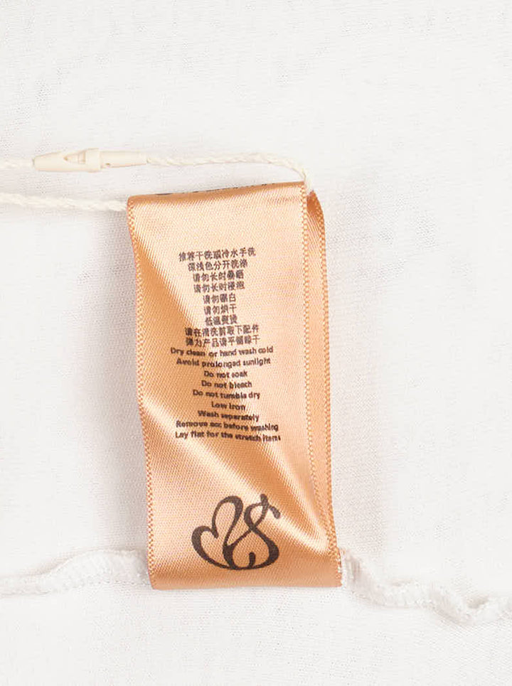 Sultry Virgin cream cable knit print strapless tube top with collegiate 'Virgin Institution' crest graphic at the hem, photographed flat on a white background - view 4
