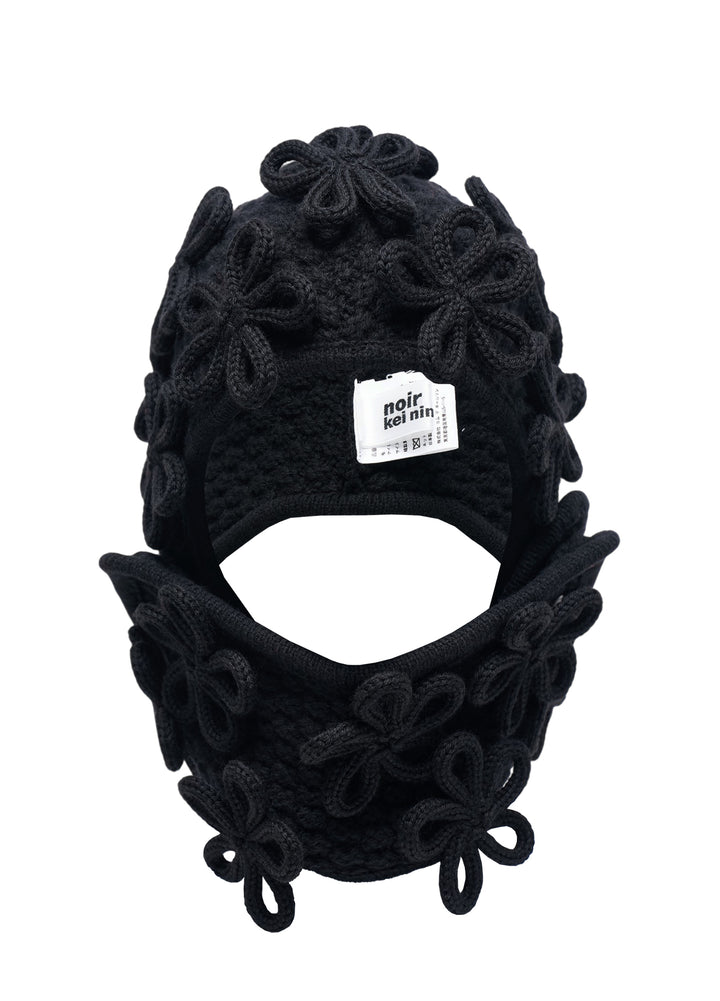 Noir Kei Ninomiya black knitted balaclava with three-dimensional looped floral appliqués across the crown and neck