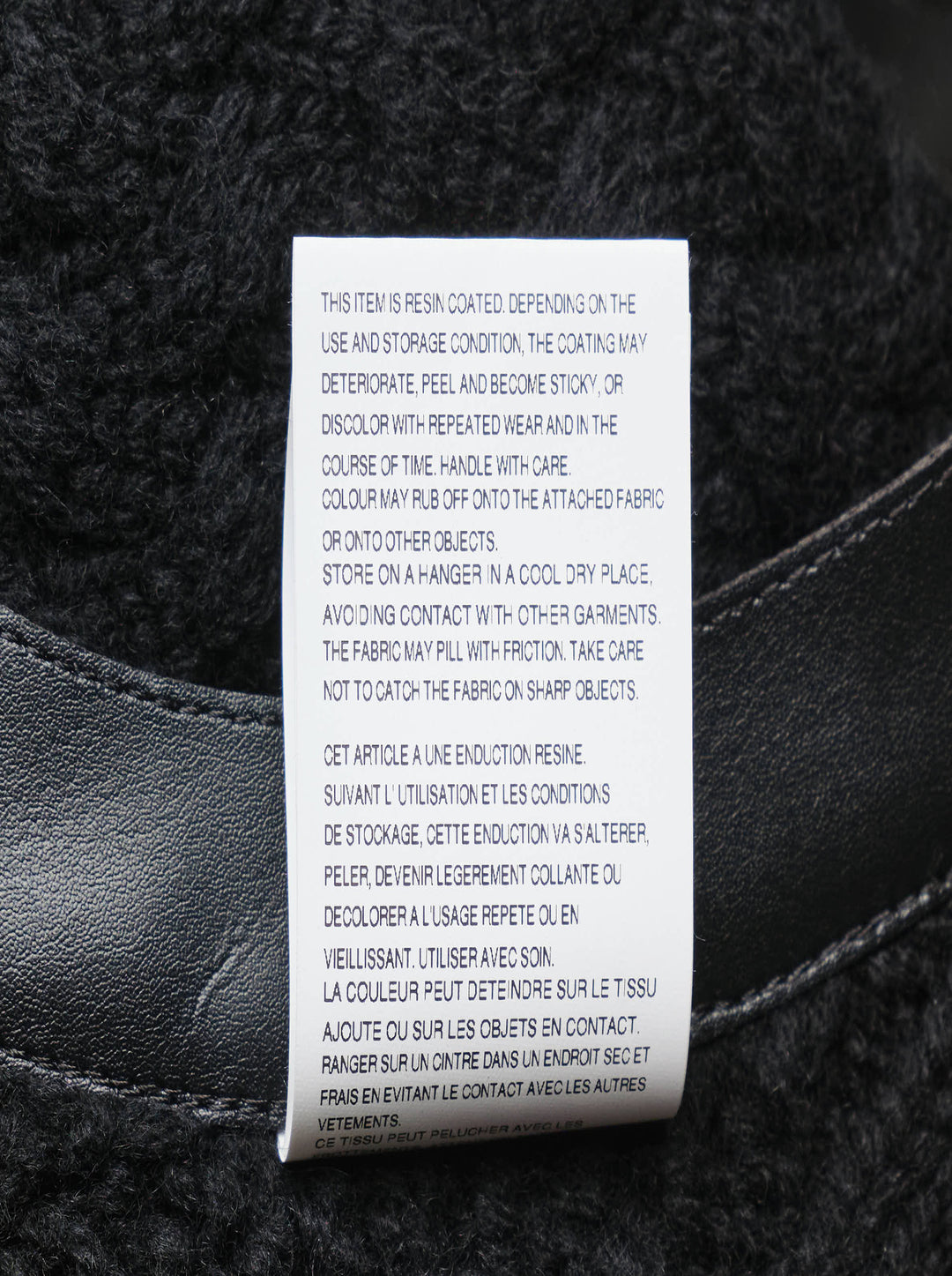 Noir Kei Ninomiya black cable-knit sleeveless vest with structured leather yoke, cutout detailing, and silver press-stud fastening at the rear neckline - view 4