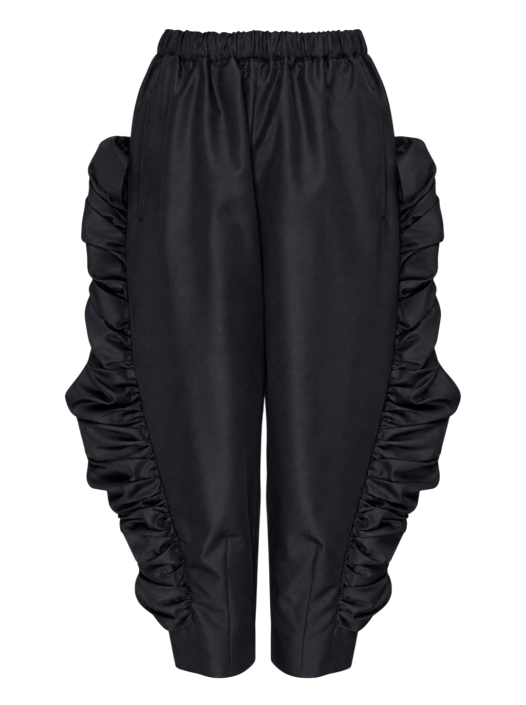 Comme des Garçons wide-leg black pants with dramatic ruched frill panels along both side seams and an elasticated waistband, displayed flat against a white background
