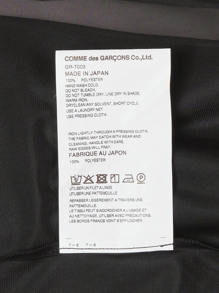 Comme des Garçons asymmetrical panelled oversize tee in black, featuring sheer chiffon flutter cape panels over an opaque jersey body, shown flat on white background - view 3