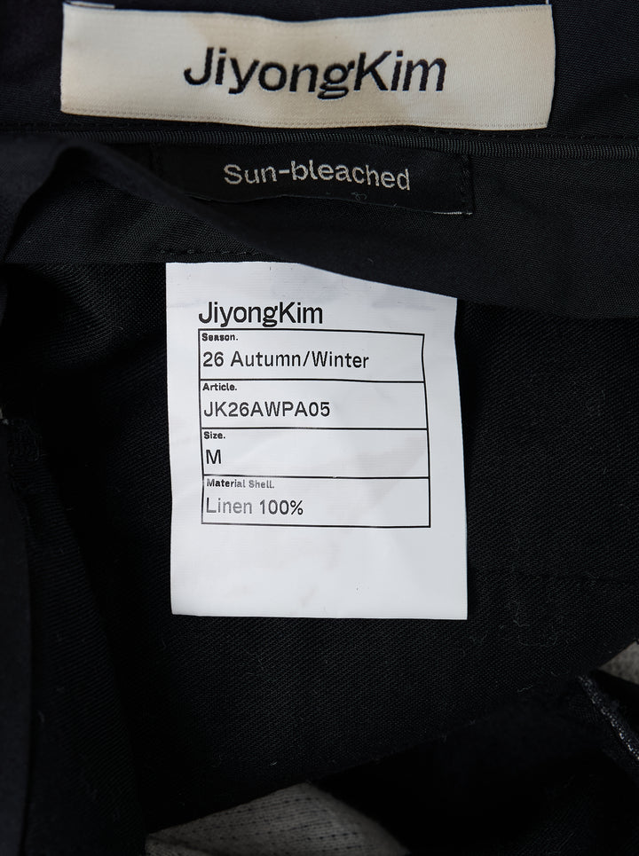 JiyongKim sun-bleached wide-leg trousers in faded charcoal with oversized 3D cargo pockets and a frayed waistband, front view - view 3