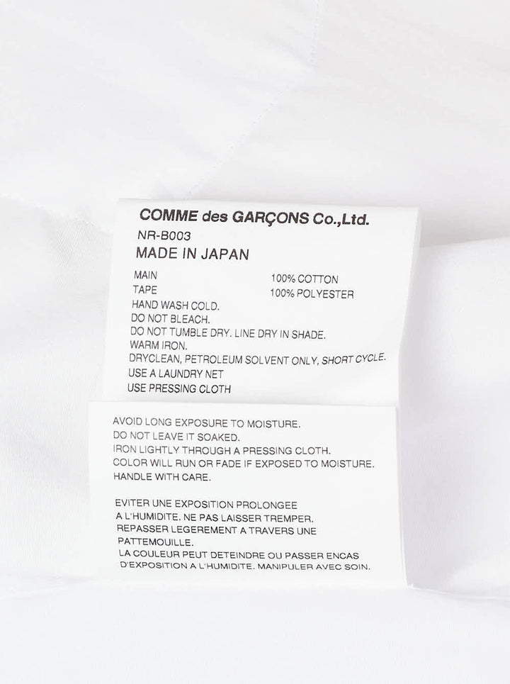 Comme des Garçons Girl white straight cut blouse with oversized collar trimmed in red grosgrain ribbon bows, shown from the front - view 4