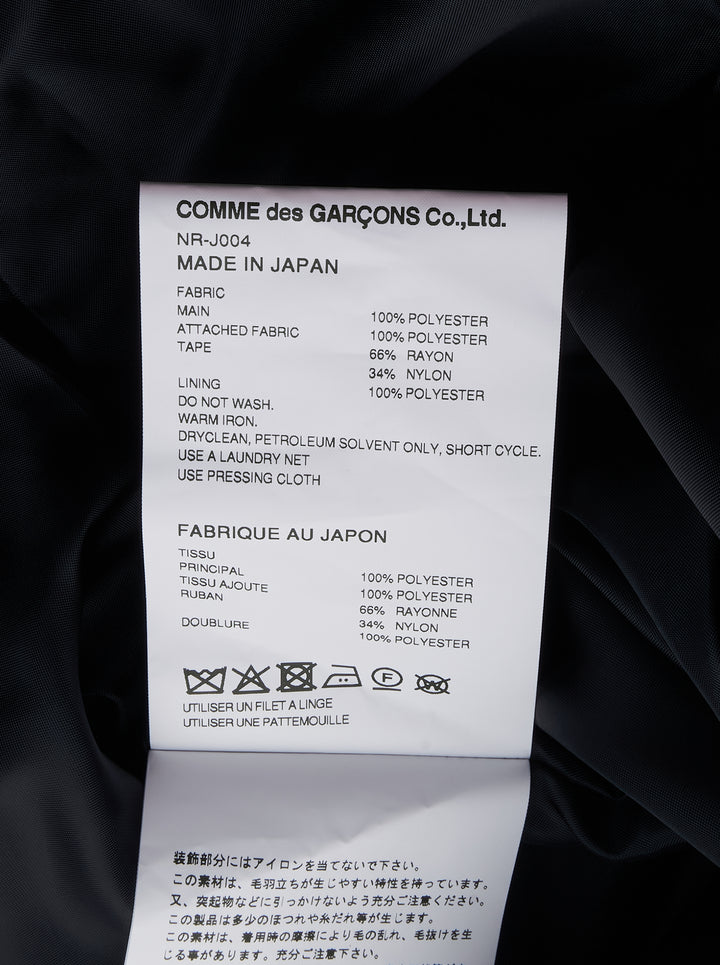 Comme des Garçons Girl black satin jacket with sheer tulle criss-cross ruffles and white ribbon bows across the front body, shown flat on a white background - view 3