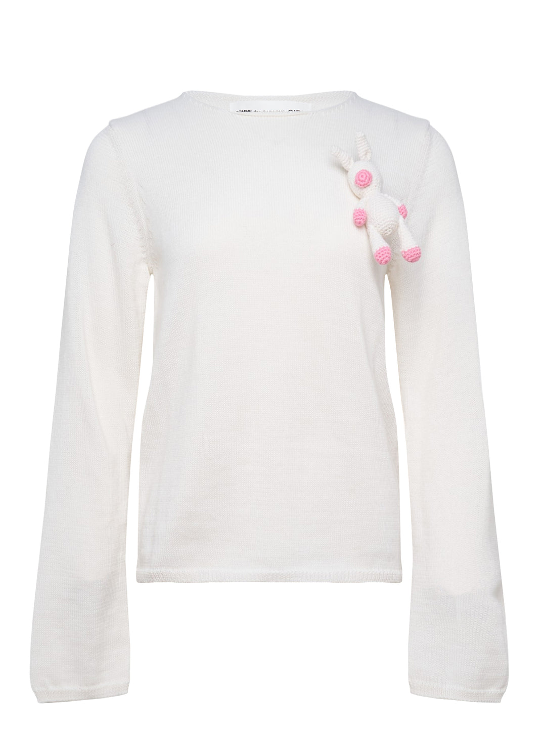 Comme des Garçons Girl ivory long sleeve fine knit top with 3D crochet unicorn appliqué in white and pink on the chest, crew neckline, flat lay on white background