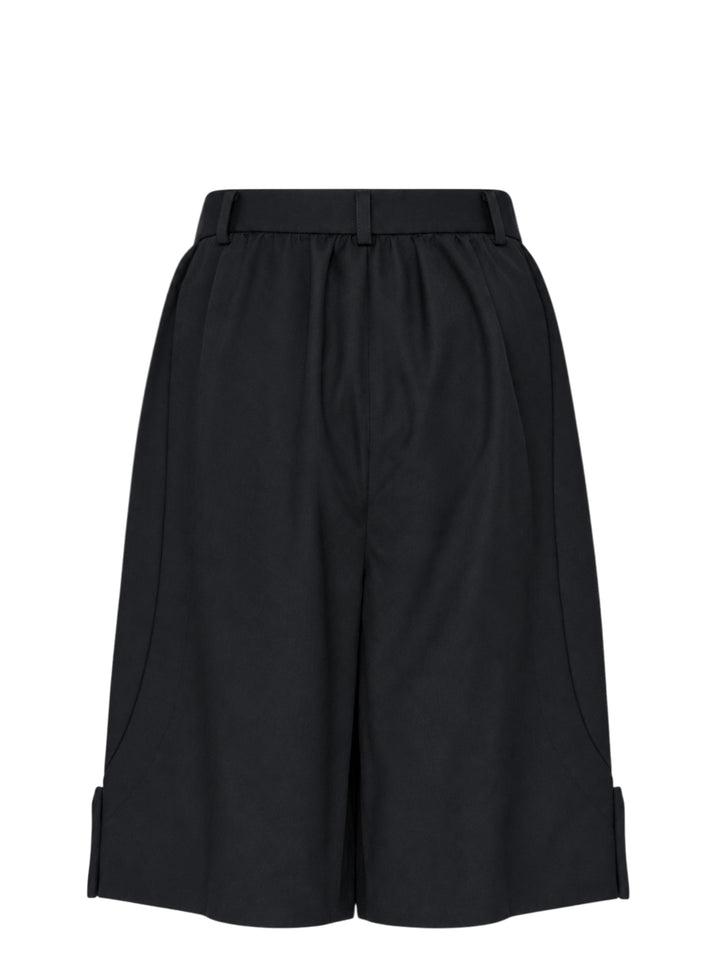 Comme des Garçons Girl black tailored knee-length shorts with wide-leg silhouette, soft pleating at the high-rise waistband, single-button closure, and cuffed hems - view 2