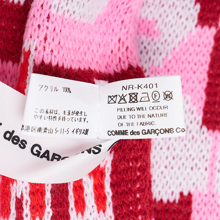 Comme des Garçons Girl holiday knitted acrylic stole with all-over reindeer and tree jacquard motifs in red, pink, and white, with fringe trim at both ends