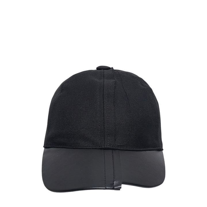 Comme des Garçons x HIZUME black velvet headband with an oversized sculptural beaded and sequined bow embellishment, shown on a white background