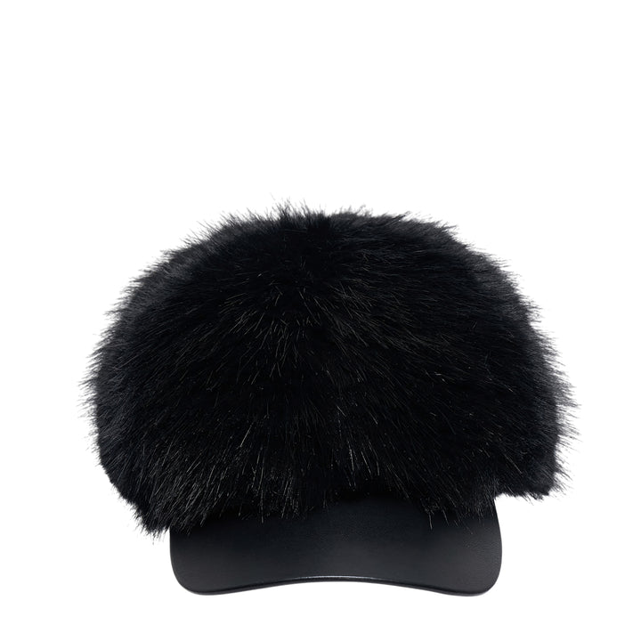 Comme des Garçons SHIRT faux fur baseball cap with a voluminous black fur dome crown and structured faux leather brim, photographed from the front against a white background