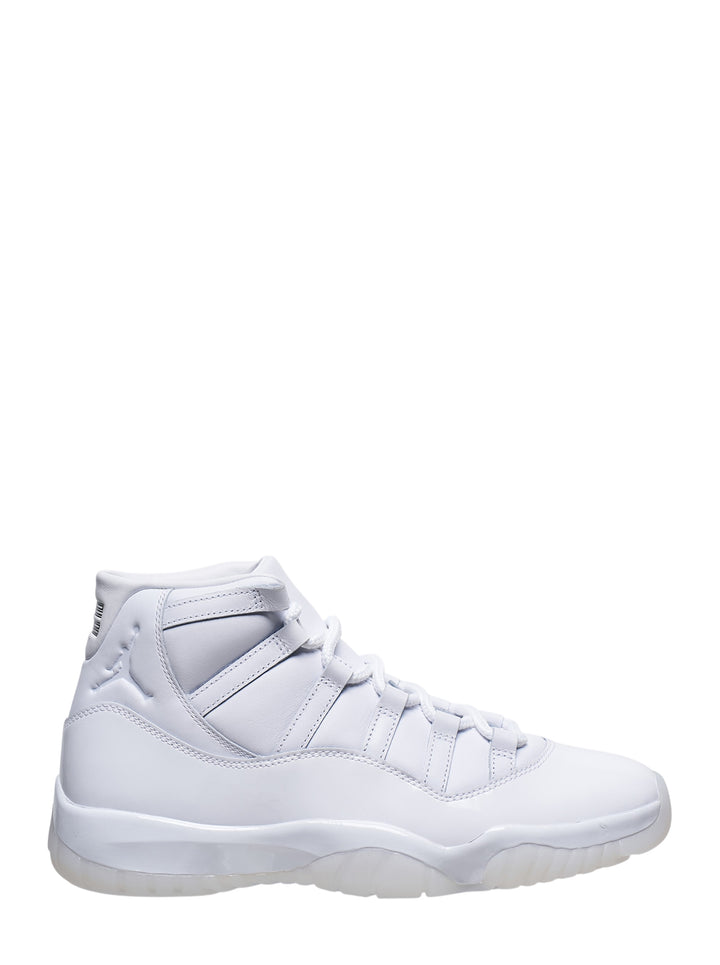 Comme des Garçons Homme Plus x Jordan Air Jordan 11 high-top sneaker in all-white leather with translucent outsole, flat white laces, and Jumpman branding at the ankle collar