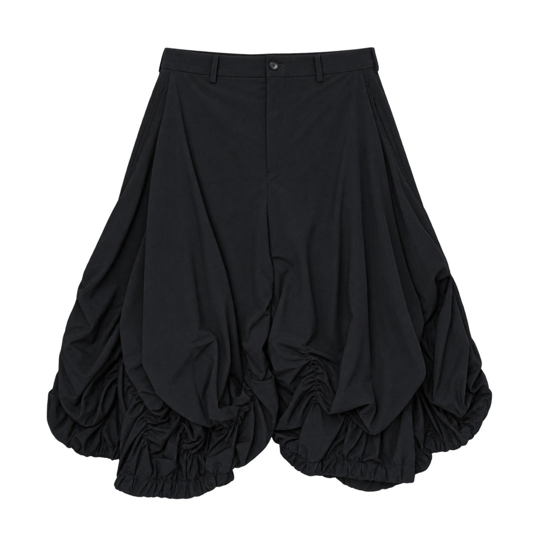 Comme des Garçons Homme Plus Wool Tropical Balloon Shorts in black, featuring a structured waistband and multiple ruched elasticated bubble hems, flat lay on white background