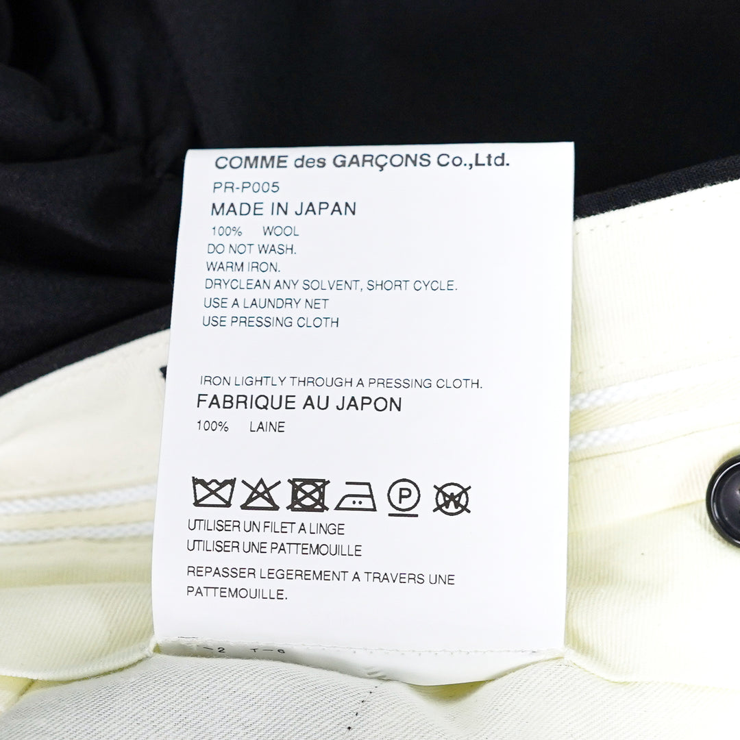 Comme des Garçons Homme Plus Wool Tropical Balloon Shorts in black, featuring a structured waistband and multiple ruched elasticated bubble hems, flat lay on white background - view 3