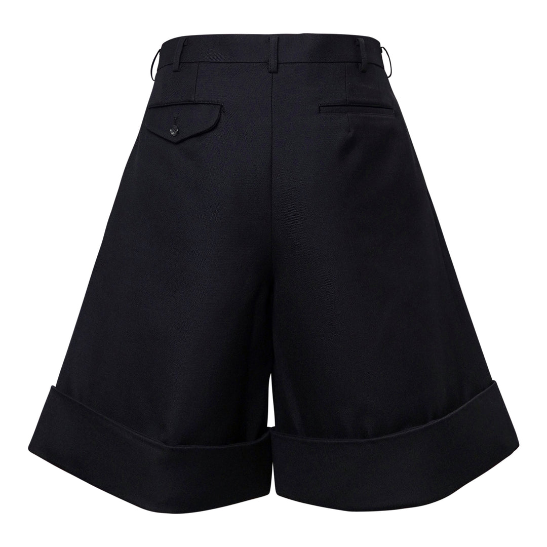 Comme des Garçons Homme Plus black double weave wool wide-leg shorts with deep pleats, button fly, and folded turn-up cuffs, shown flat on white background - view 2
