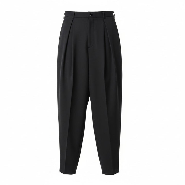 Comme des Garçons Homme Plus wool gabardine double-pleat high-rise tapered trousers in dark charcoal, flat lay on white background