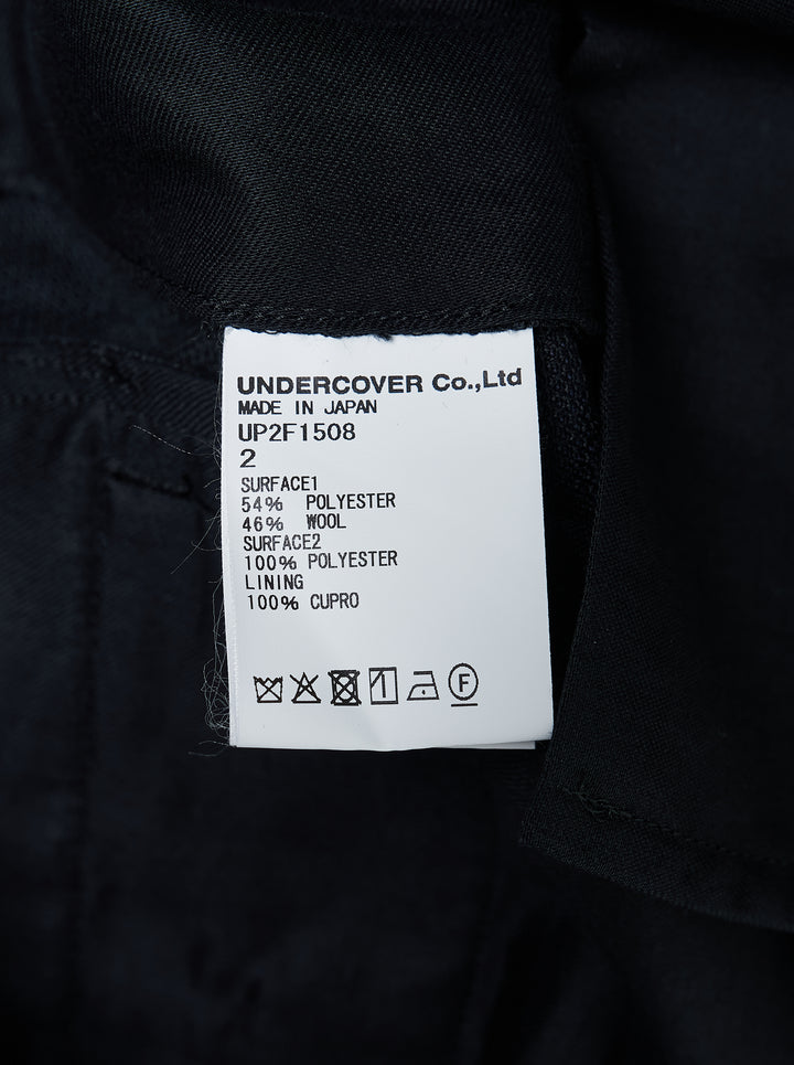 Undercover layered trousers in black and charcoal with a sheer overlay panel and straight-leg cut, front view - view 3