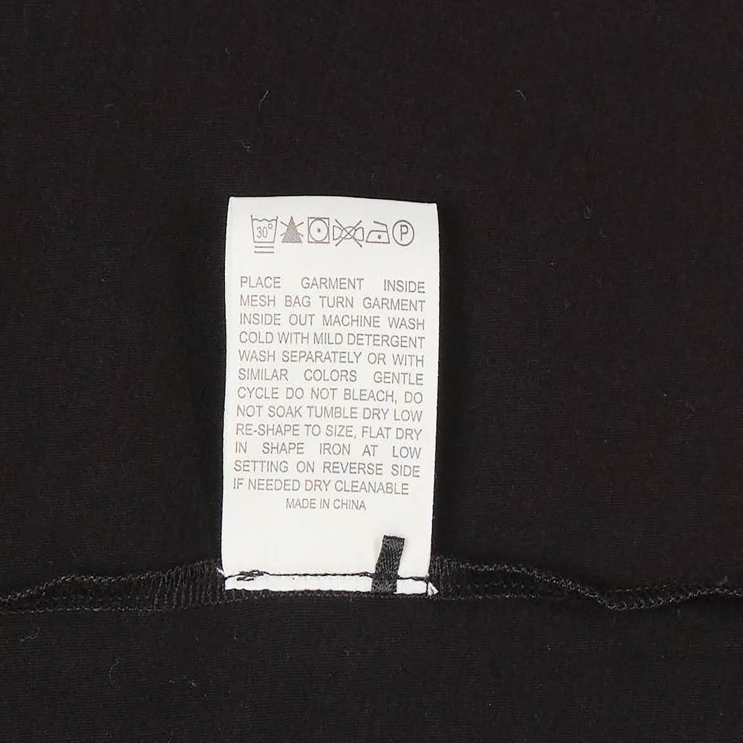 Club21 Collection black long sleeve Henley knit top with tonal button placket and ribbed crew neckline, displayed on a ghost mannequin against a white background